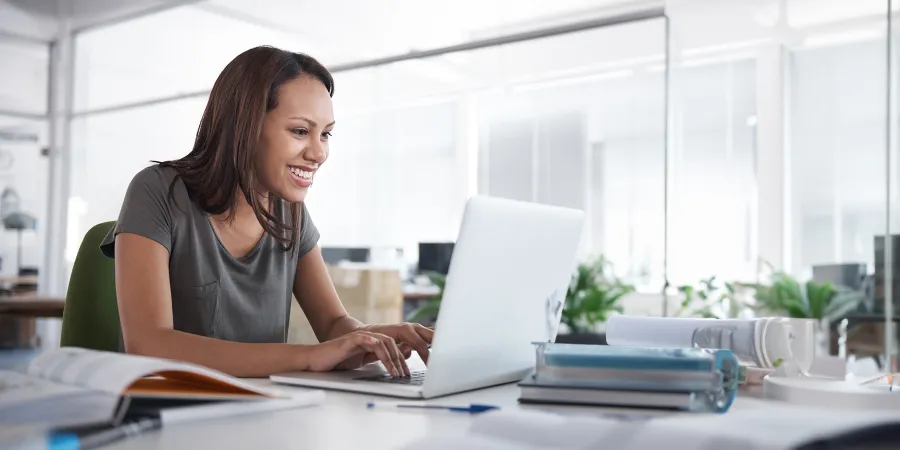 Online Student with Laptop Taking Classes at Home