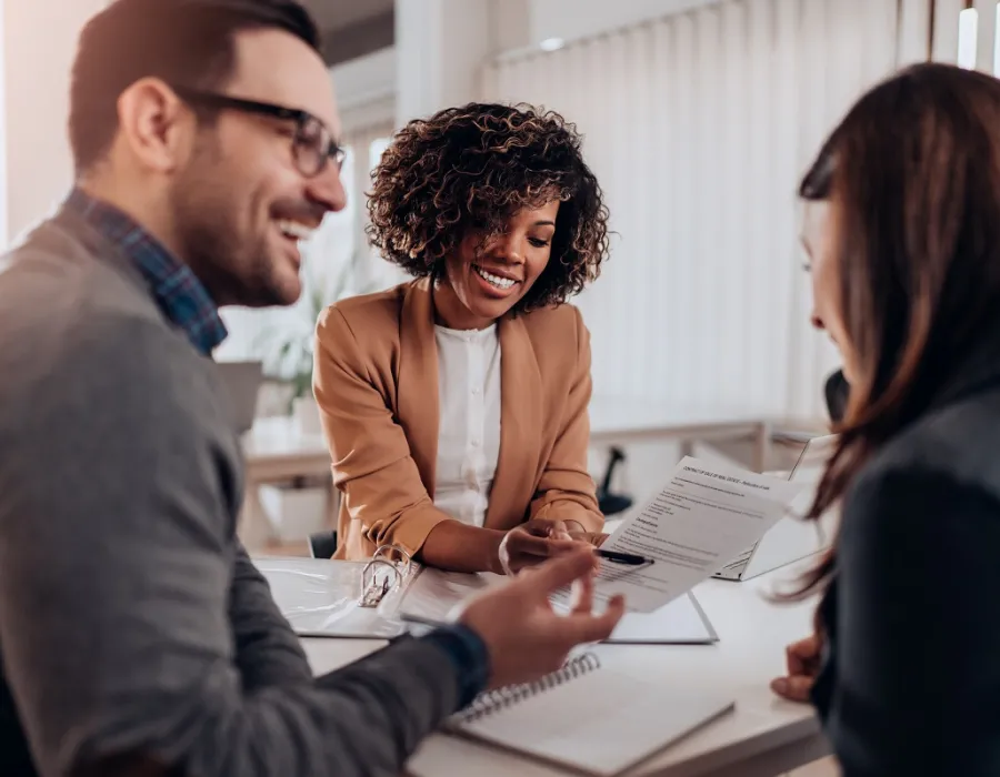 Accountants reviewing balance sheets in team meeting
