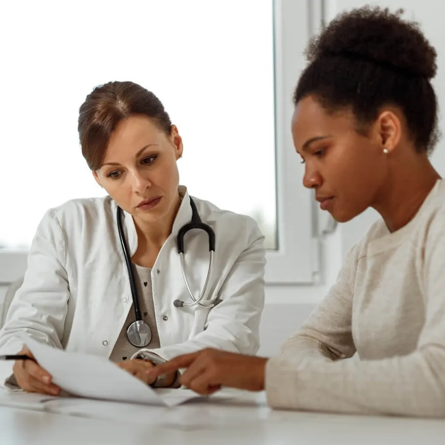 DNP Nurse Practitioner Consulting Diagnosis with Adult Patient