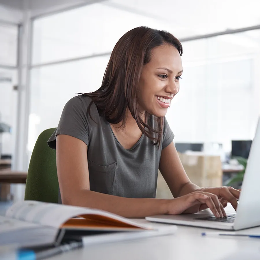 Online New Banner Test Online nursing student seated at laptop in home