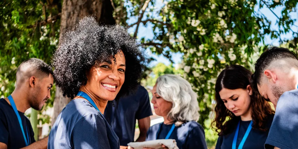 Portrait of mature volunteer woman outdoors