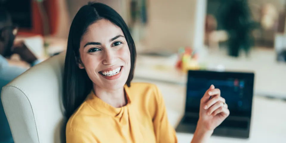 Professional stock trader monitoring stock prices and financial data in a modern trading office environment. Represents investment strategy and market performance.