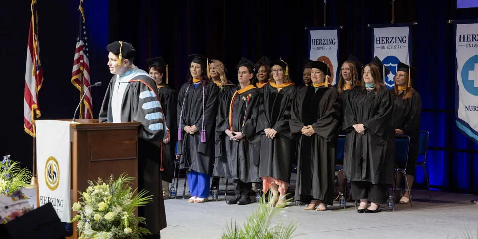 Herzing Akron faculty and leadership observing commencement ceremony