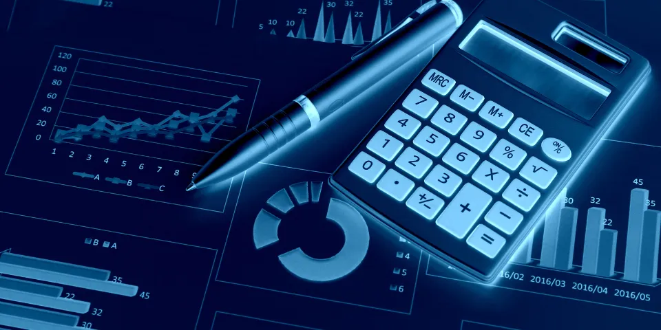 Calculator and financial documents on a desktop