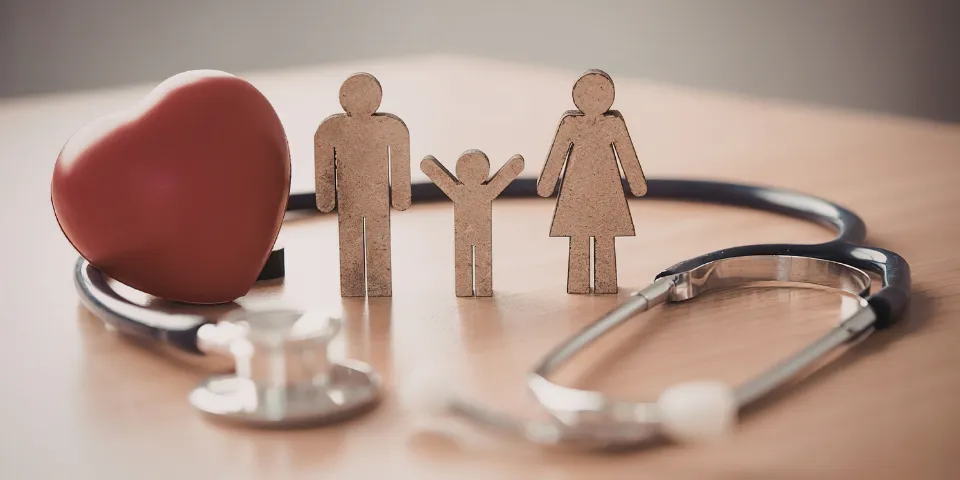 Healthcare heart surrounding a family with child