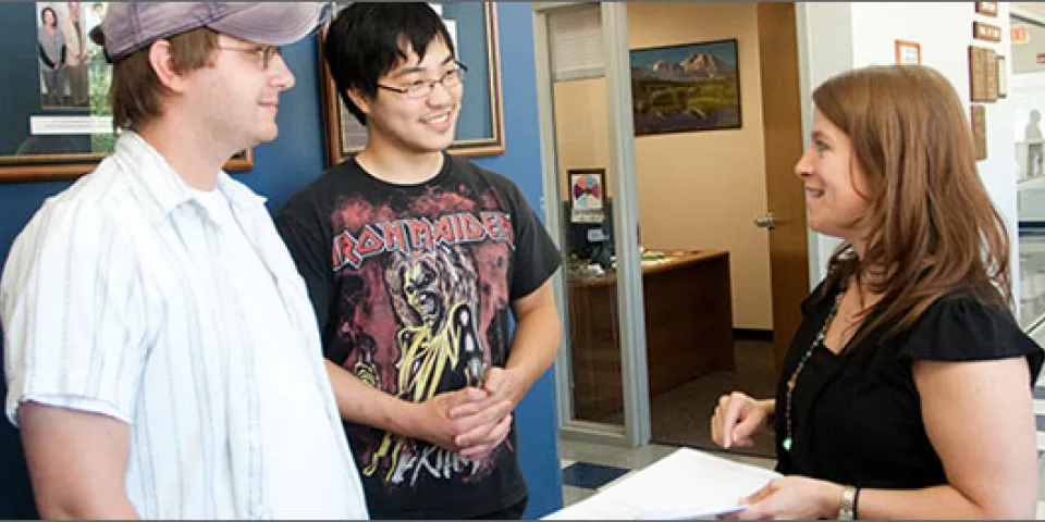 Students speaking with instructor