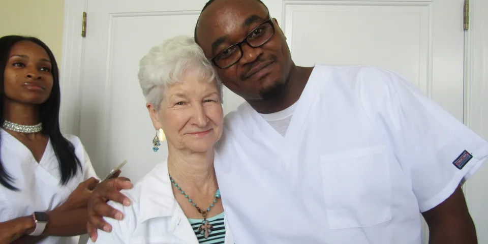 James Wanjiru smiling with patient Ms. Small