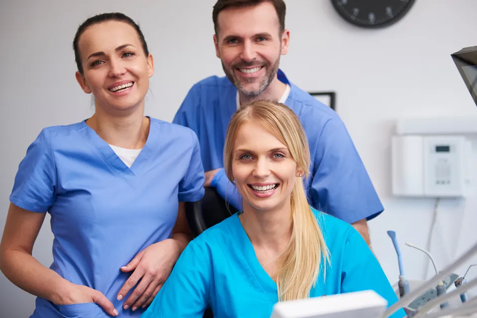 Smiling Team of Medical Assistants in Clinic