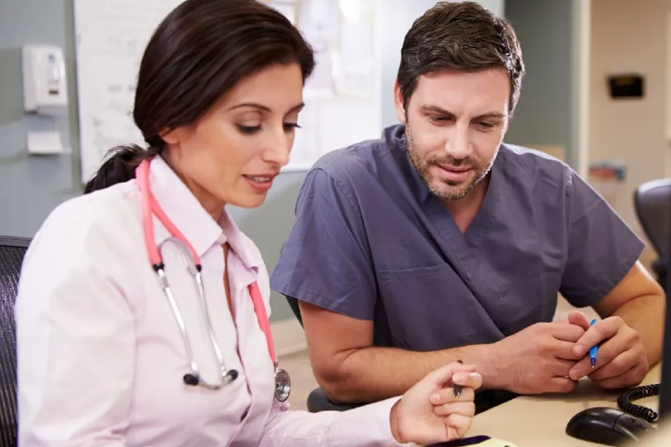 Registered Nurse and Nurse Practitioner at Nurse's Station