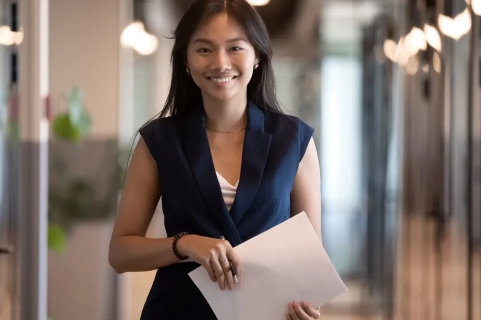 Human Resources HR Manager Smiling with Notes for Meeting