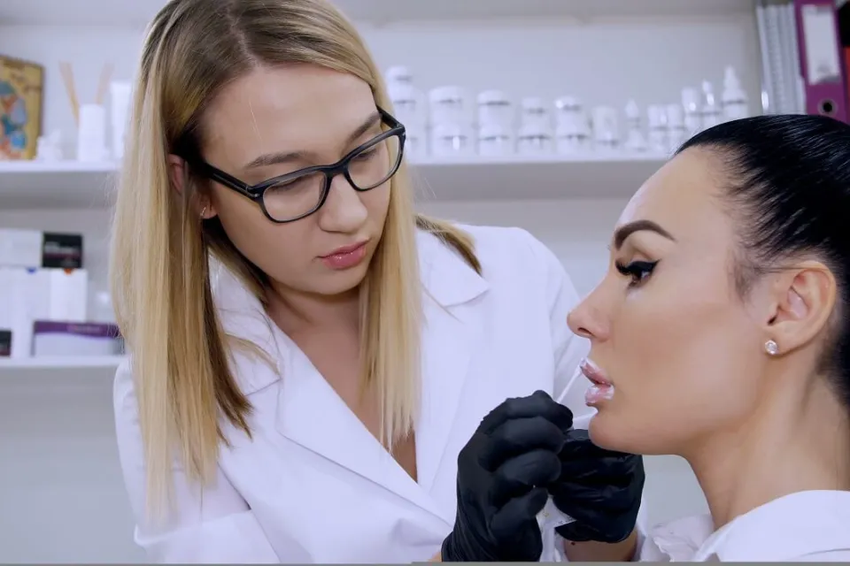 Cosmetic Registered Nurse Preparing Patient for Lip Procedure