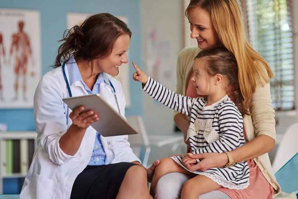 Nurse Practitioner Smiling with Pediatric Patient